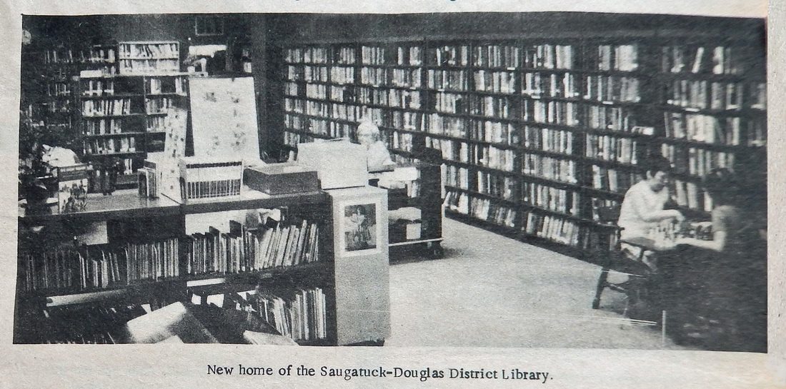 Library interior with bookshelves and patrons