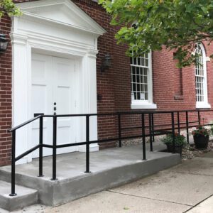 Accessible ramp leading to building entrance.