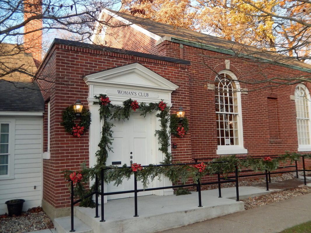 Brick building decorated with holiday garlands