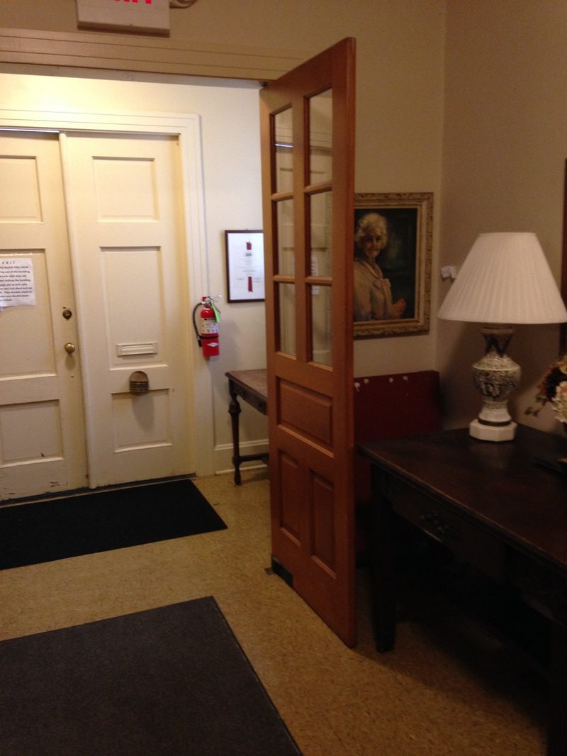 Hallway with painting and fire extinguisher