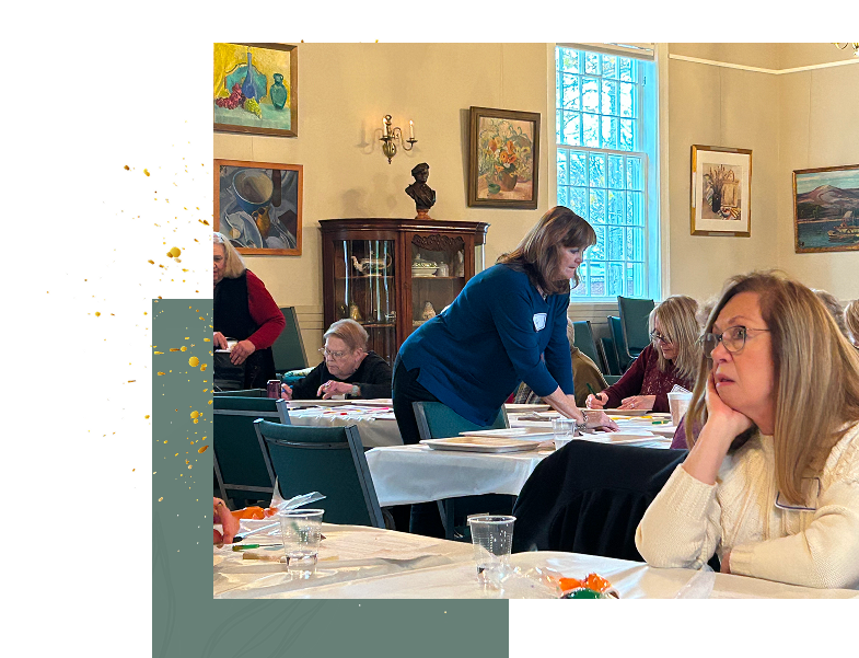 Women crafting at tables in art workshop