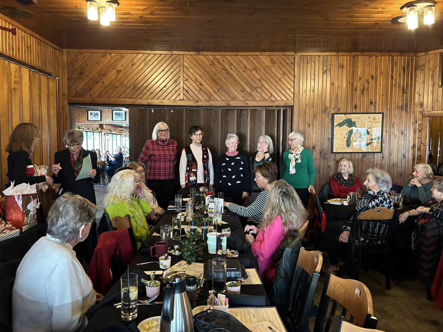 Group of women dining in wood-paneled room