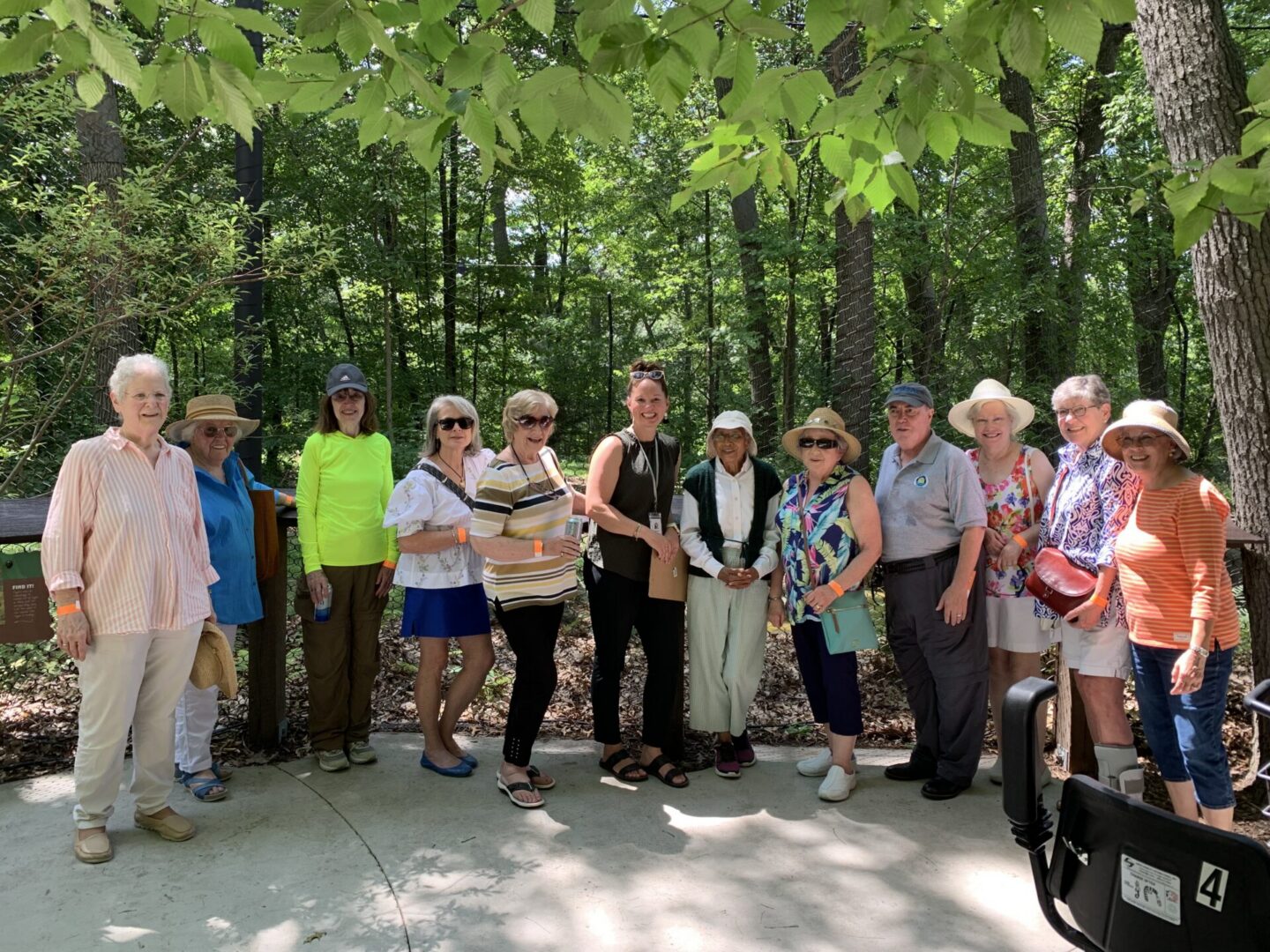 Group of seniors posing on wooded trail